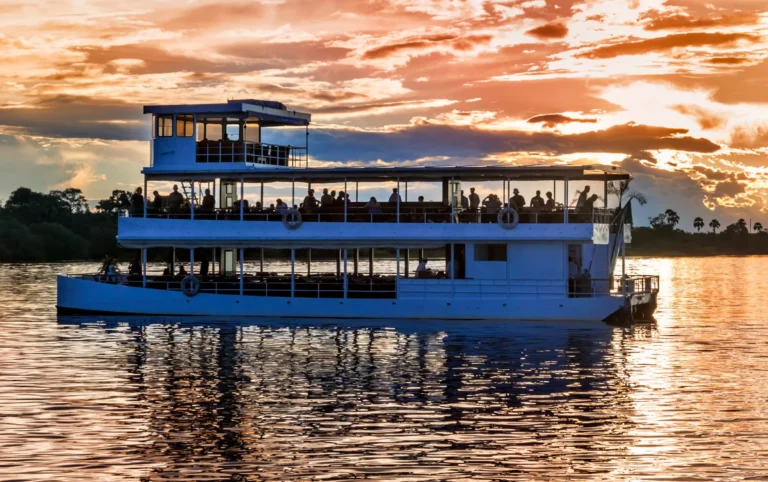 Cruise boat on the Zambezi River at the end of the day